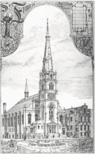 Man lighting a candle inside a church with stained glass windows.