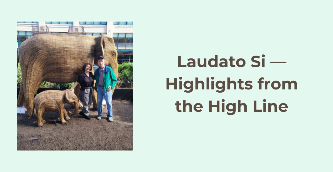 Laudato Si: Highlights from the High Line. An older man in a green jacket and baseball cap and a woman with dark curly hair and glasses stand smiling together in front of two sculpted elephants. The elephant sculptures are an adult and a baby.